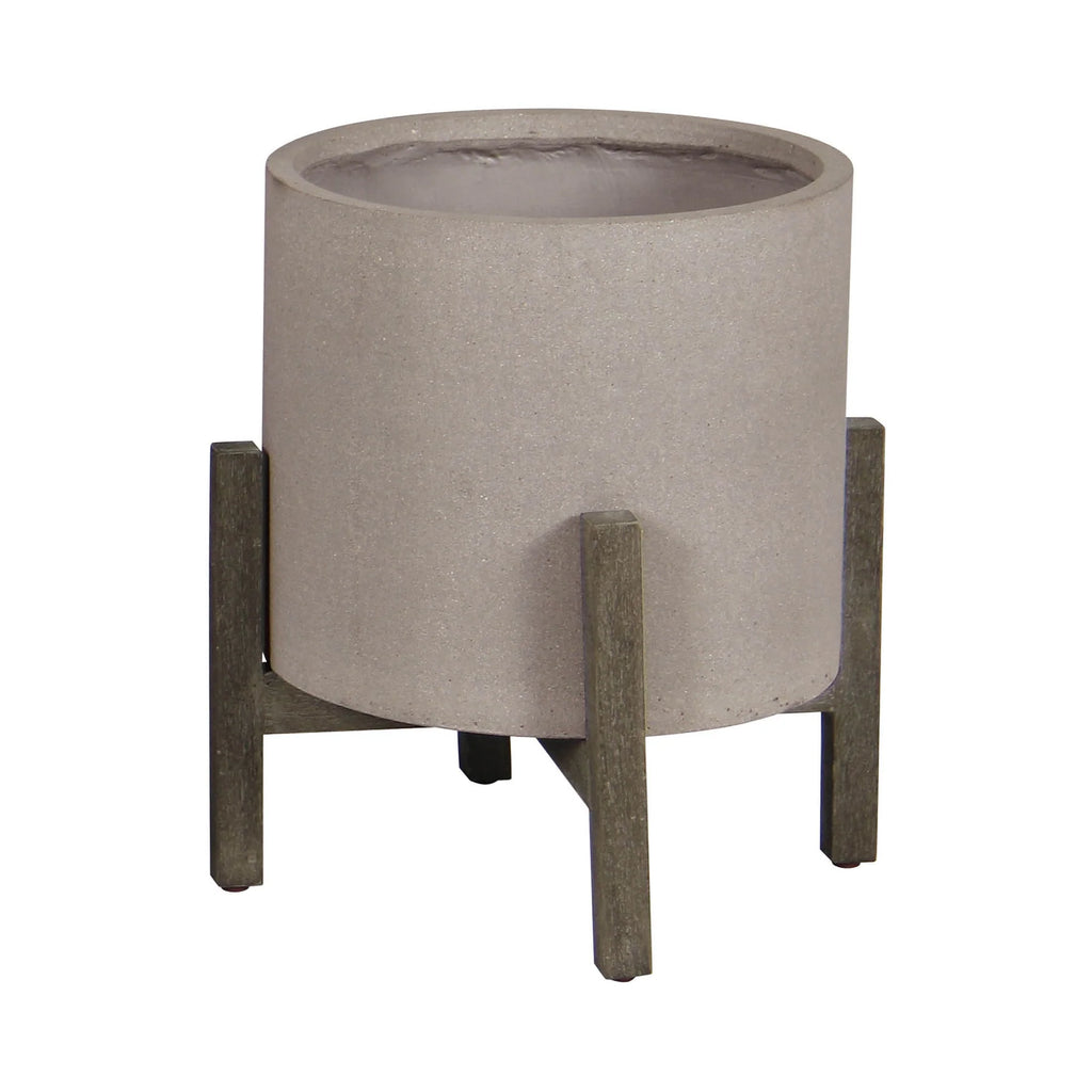 Concrete planter with wooden legs on a white background
